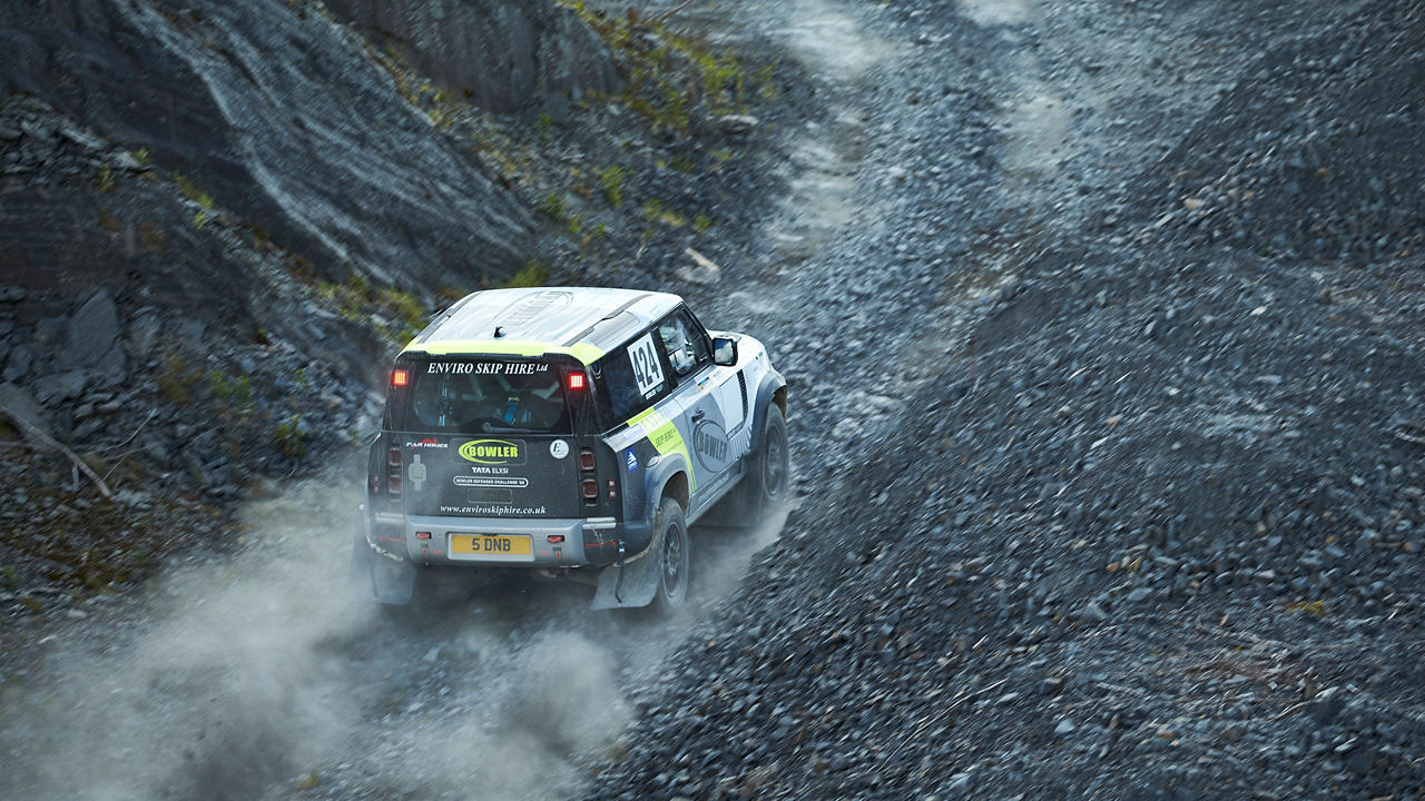 Land Rover Defender climbing the mountain