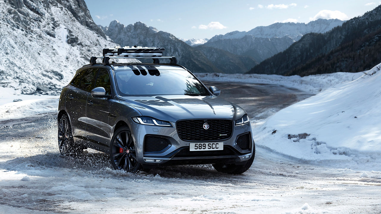 Parked Jaguar F-Pace  with  Snow Hill background