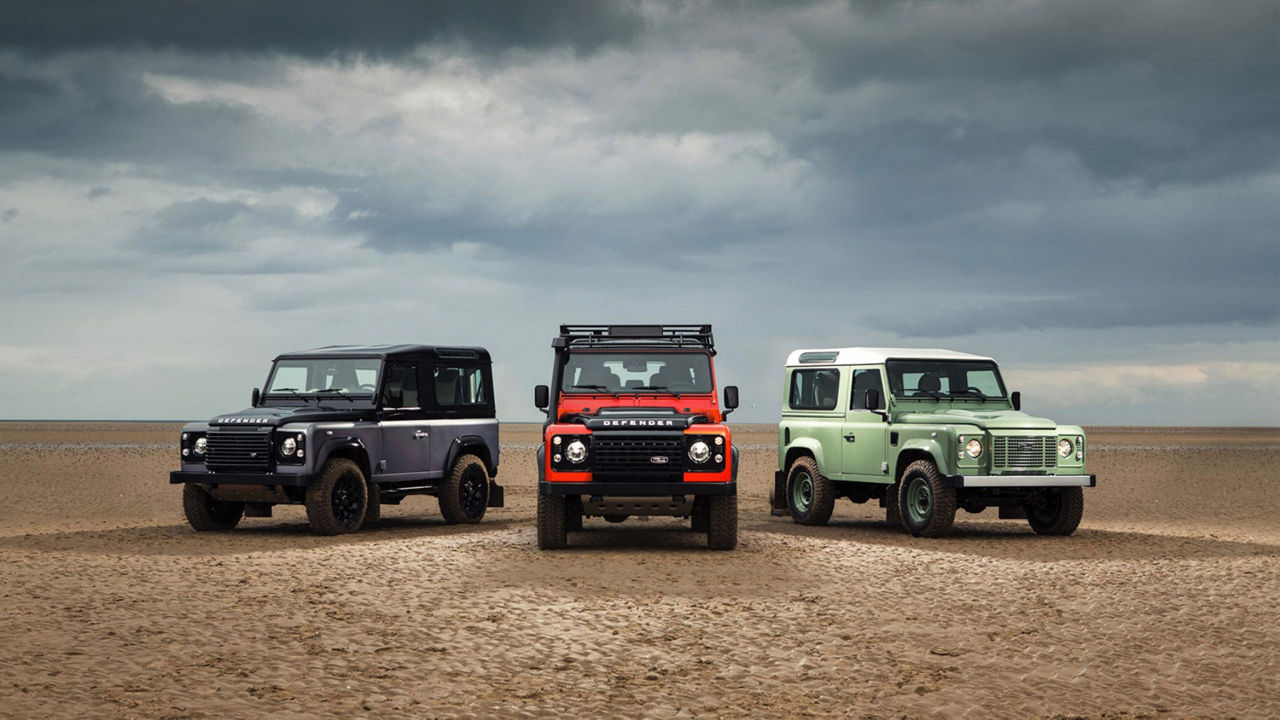  Three new Limited Edition Defenders (2015) in Black, Red and Green on beach