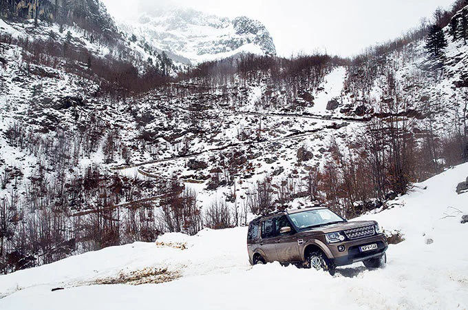 Range Rover driving through snow