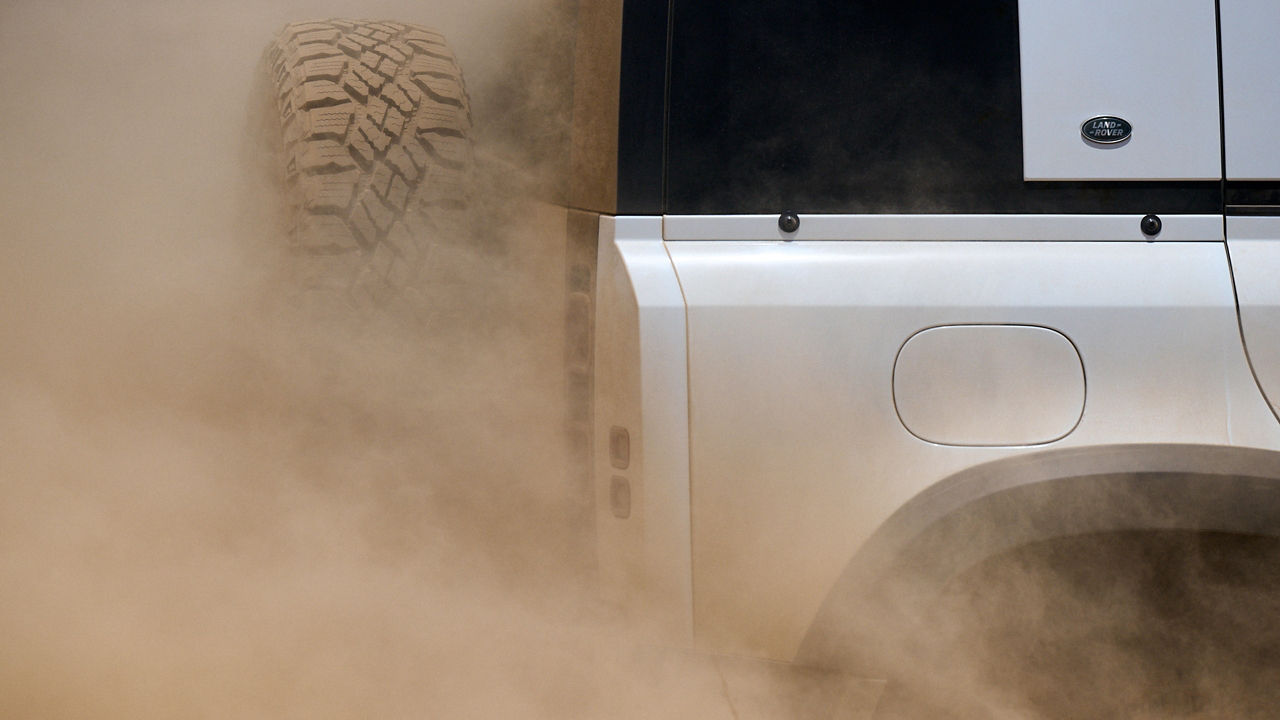 Defender Running on a Desert Road