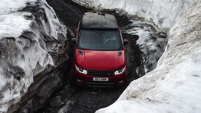 Red Range Rover in lake