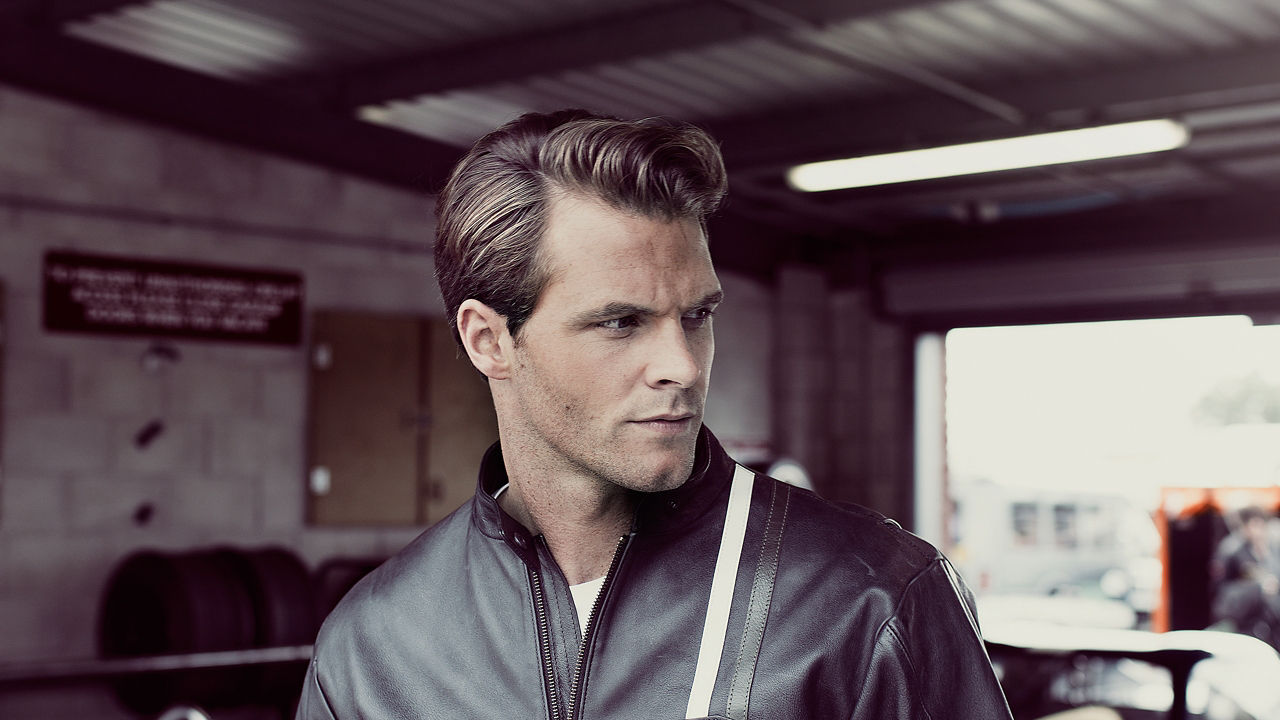 Man with Jacket Posing in Garage