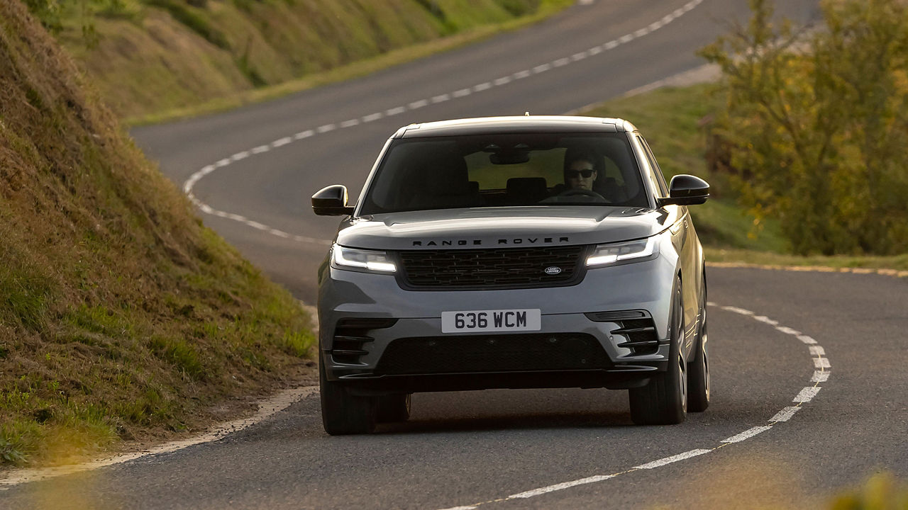 RR velar running on the road in green valley