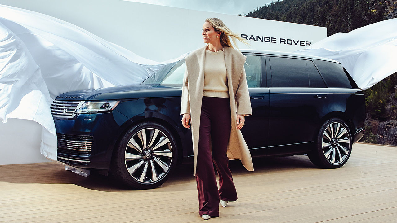Lindsey Vonn standing in front of a Range Rover