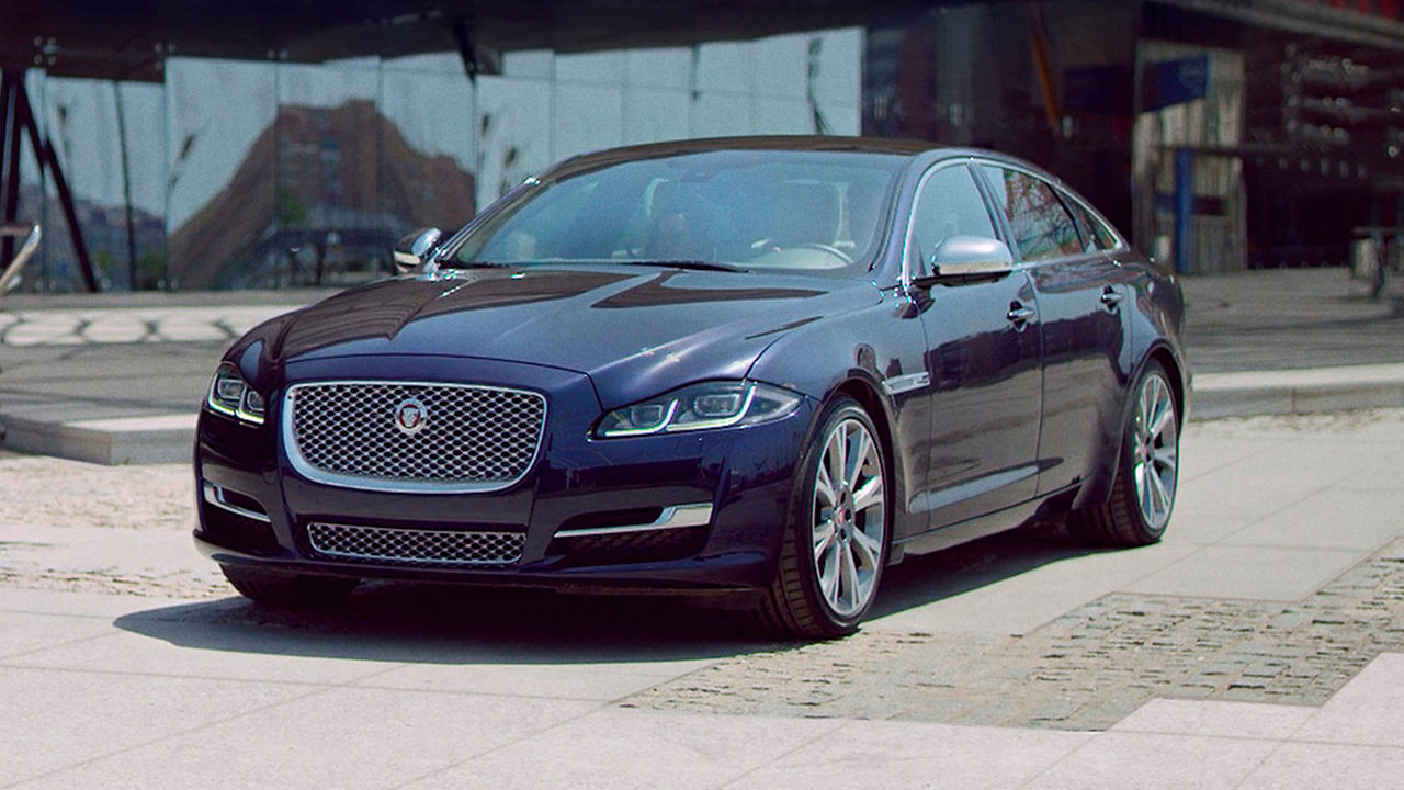 Jaguar XF parked on city road