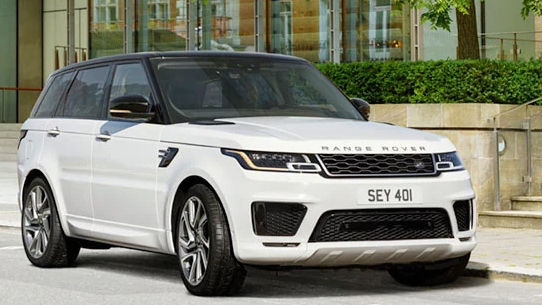 Land Rover Phev Vehicle driving down the road 