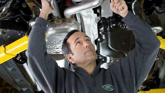 A man servicing a car