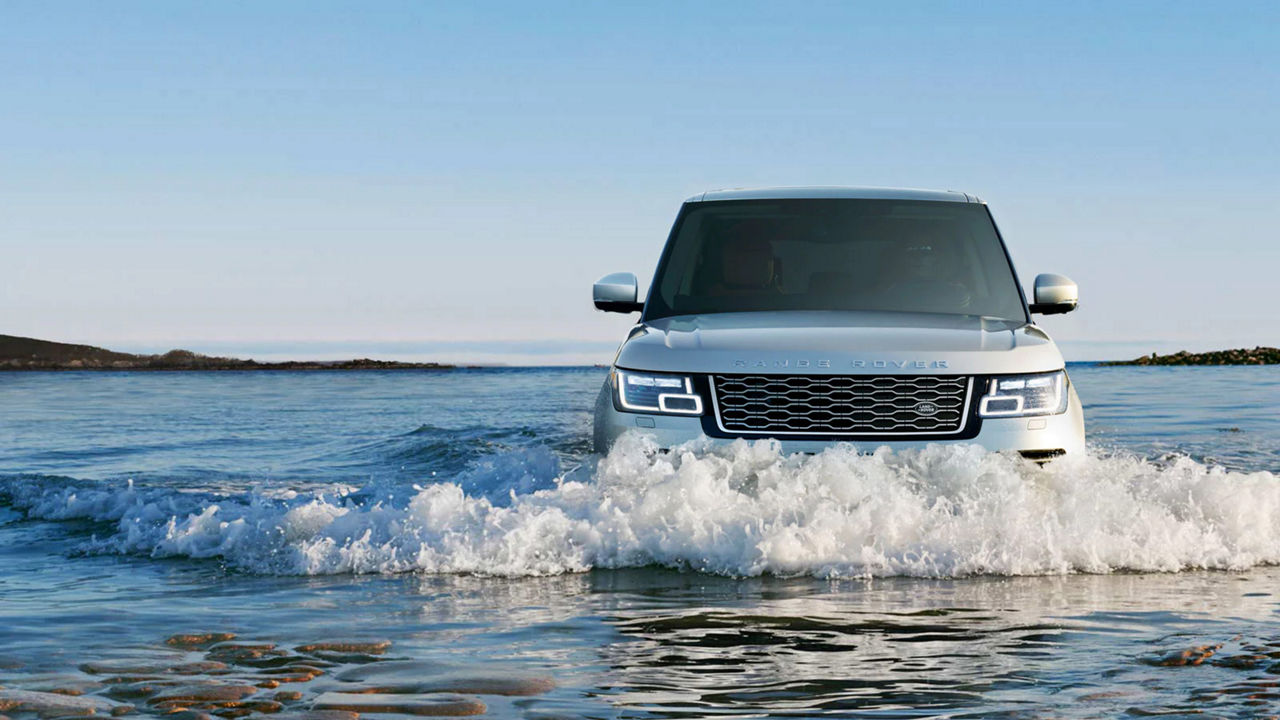 Range Rover Phev off-road driving in water