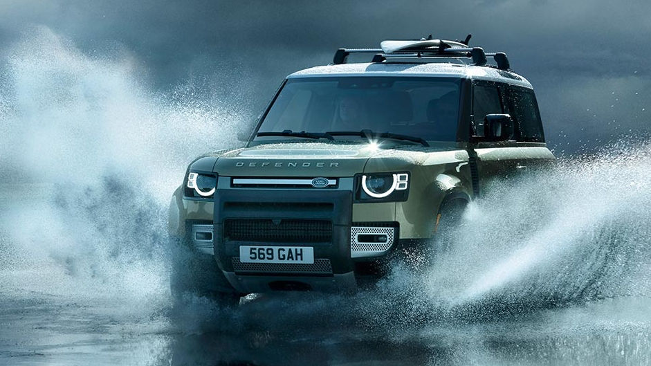 Land Rover Defender off-road driving through water