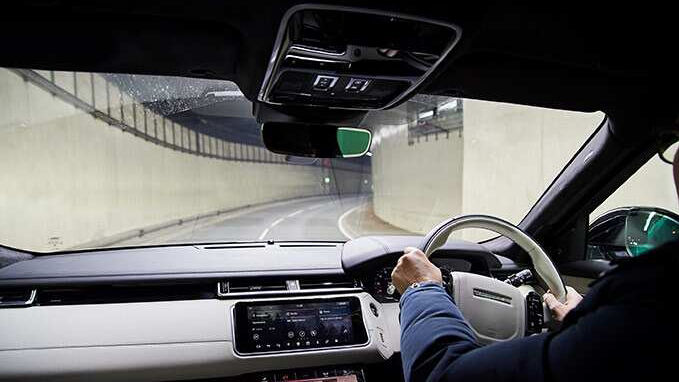 Inside view of a man driving round a bend