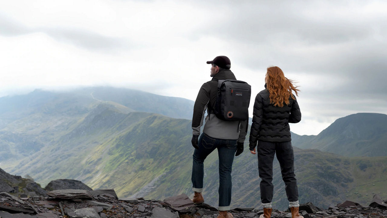 2 people looking at the view from the mountain top