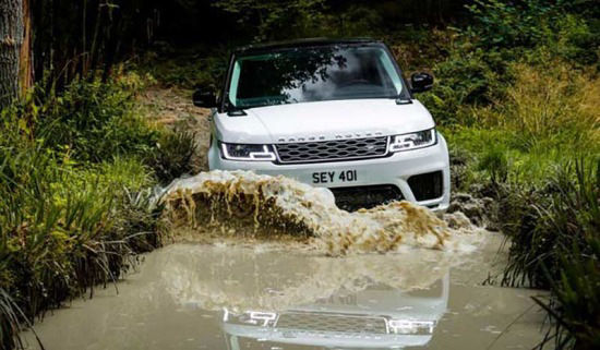 Range Rover driving through water