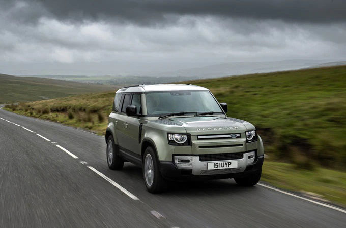 Range Rover driving on road