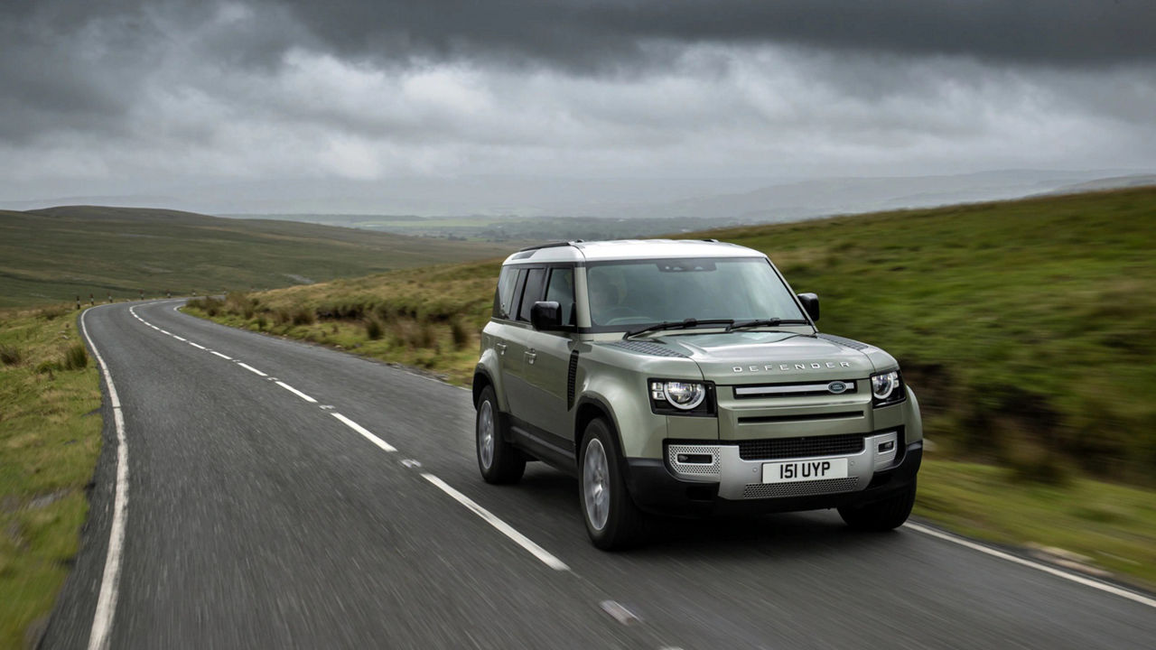 Range Rover Defender driving through road