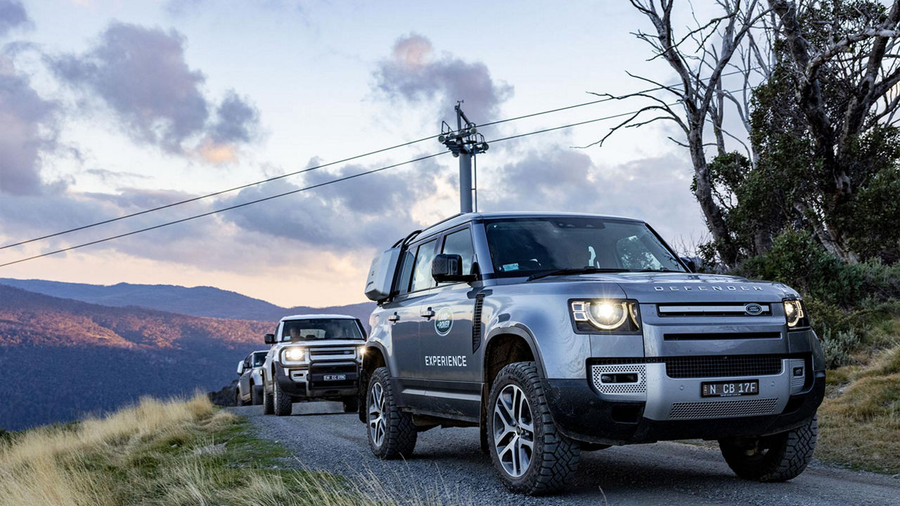 Defender vehicles driving in a convoy