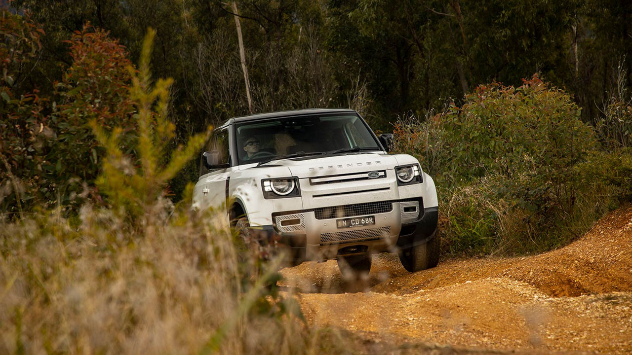 Defender driving off-road