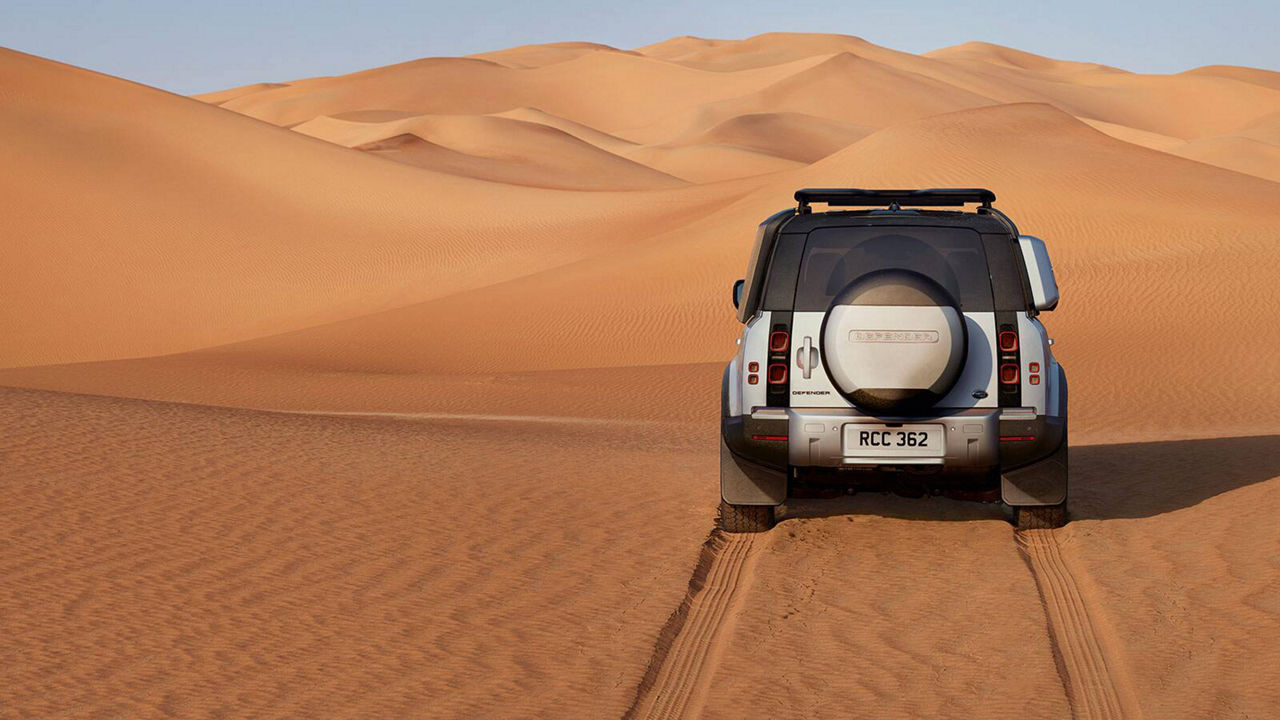 Back shot of Defender in desert