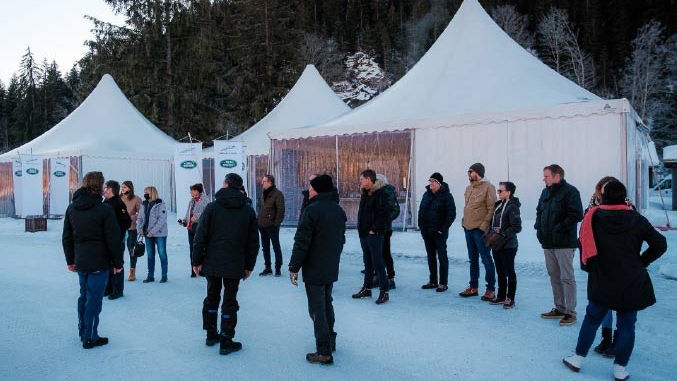 Participants standing on ice and snow