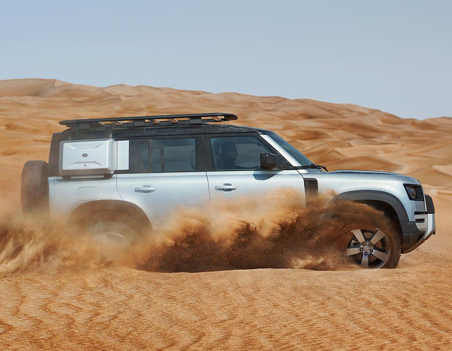 Land Rover Defender off-road driving in the desert