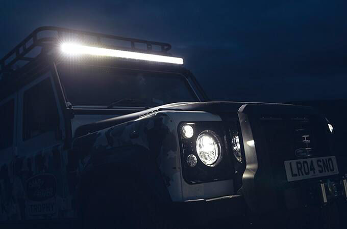 Range Rover Defender driving at night