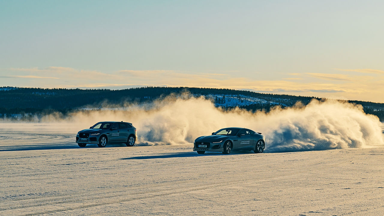 Tow Jaguar F TYPE passes through a snowdrift and snowy land road