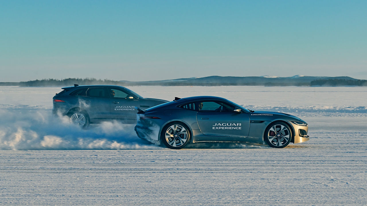Tow Jaguar F TYPE passes through a snowdrift and snowy land road