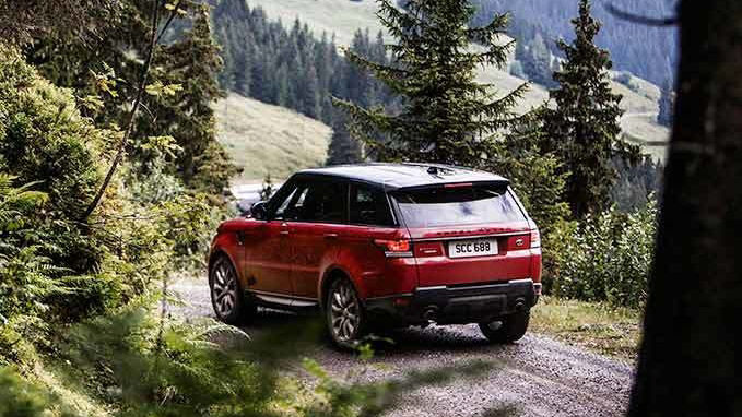 Red Range Rover in mountain