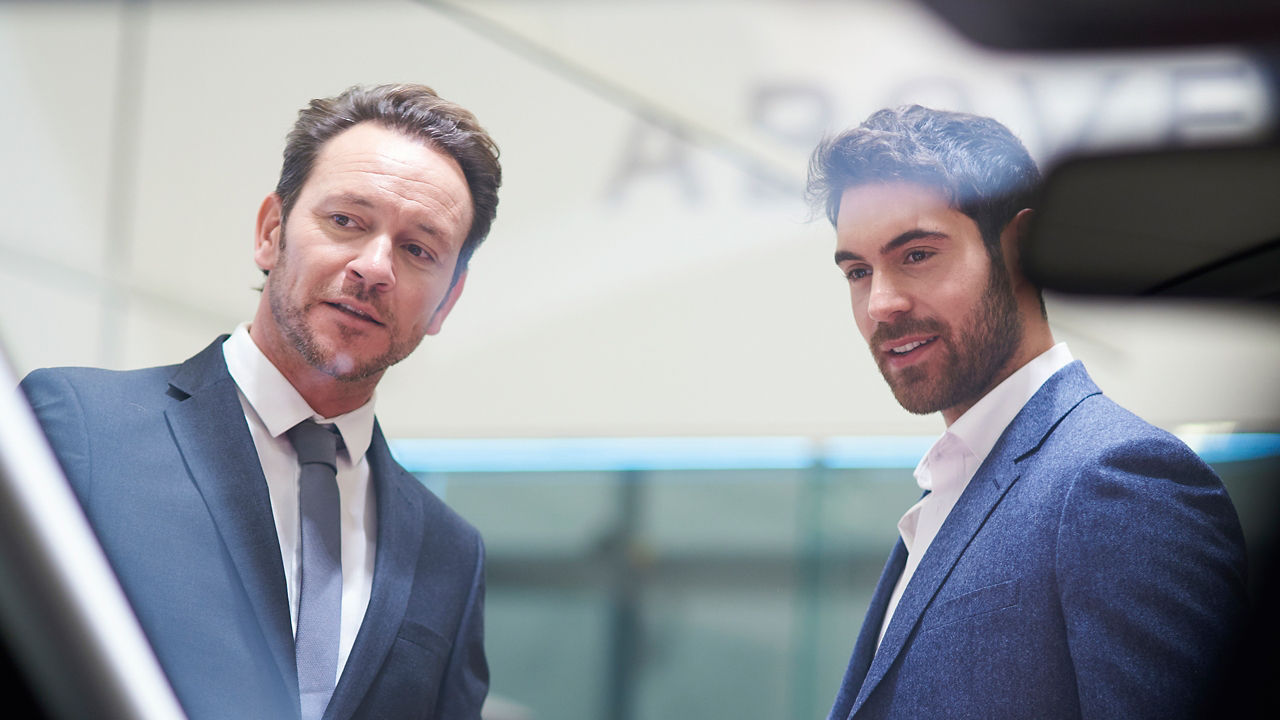 Two Business Man in Jaguar Showroom