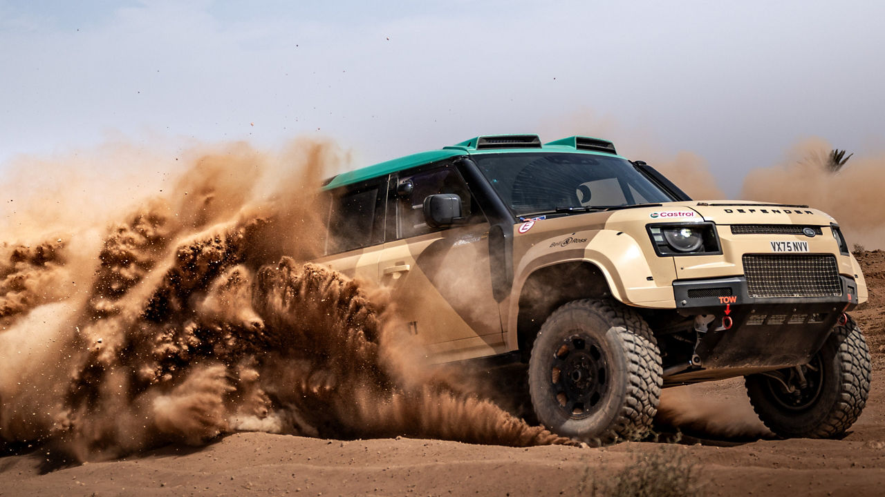 Defender Defender D7X-R in action racing through the off-road terrain. 