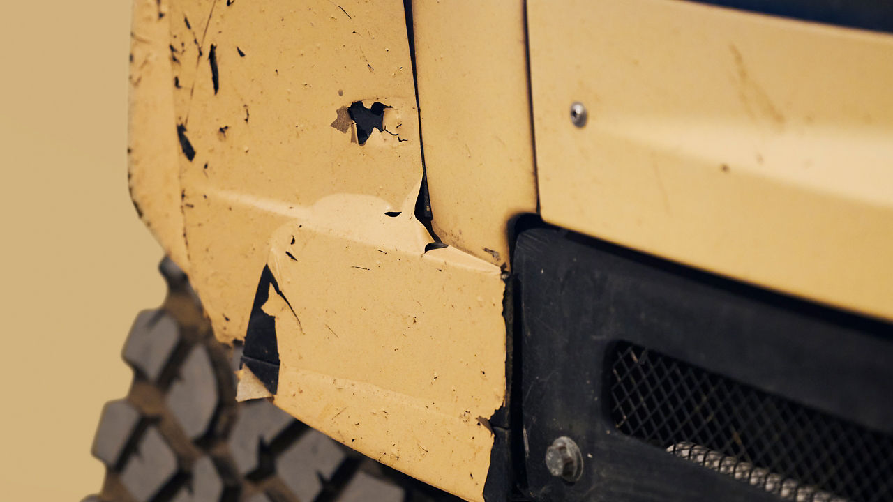 Defender Dakar back headlight dent closeup