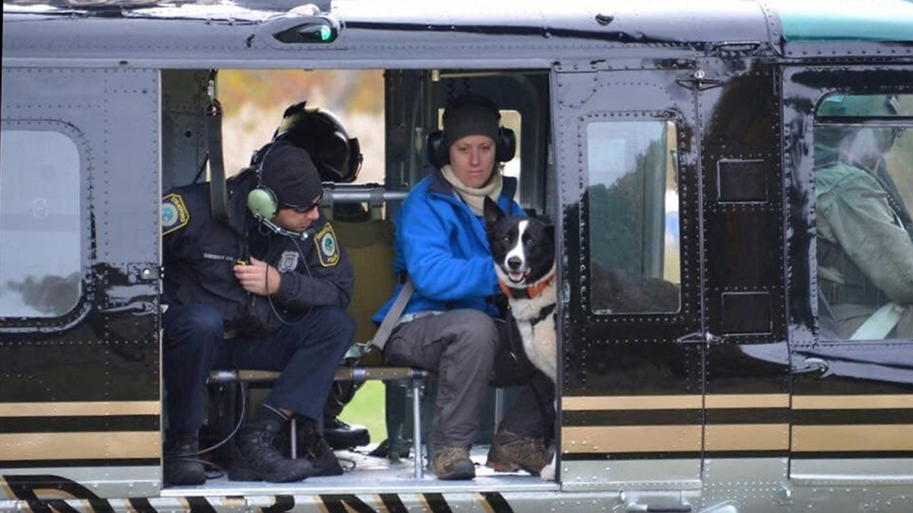 Man with dog in helicopter