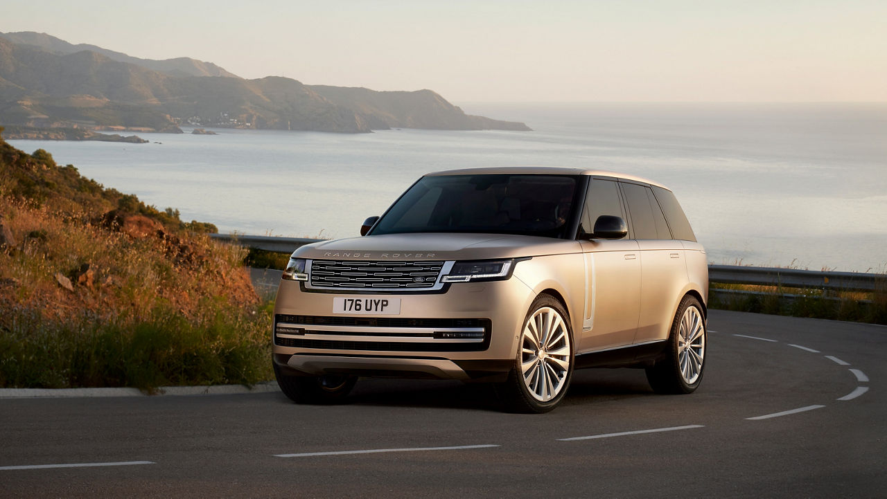The New Range Rover driving along a coastal road