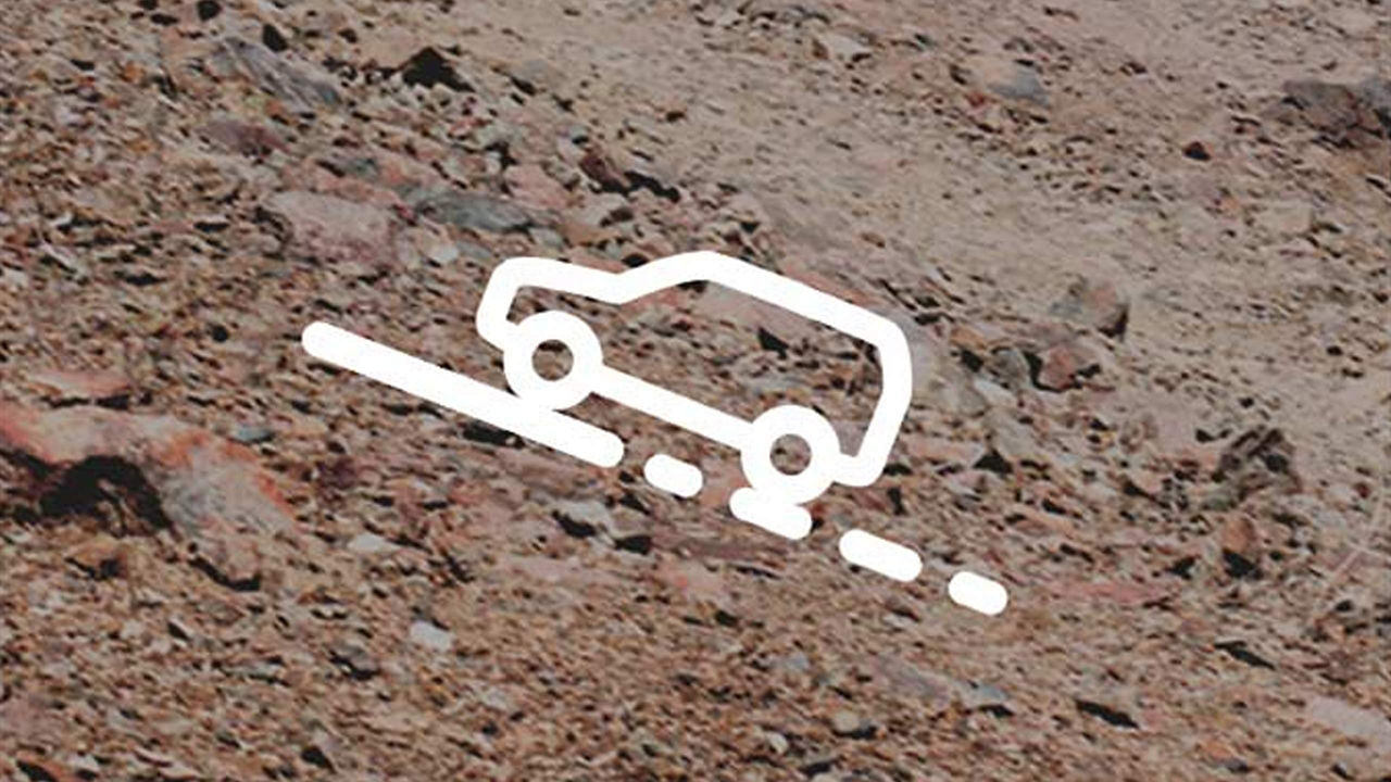 An outline of a vehicle going up an incline