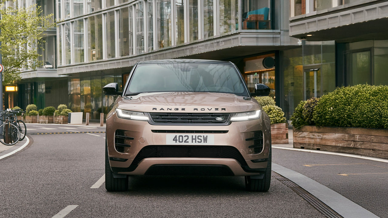 Range Rover Evoque driving on city.