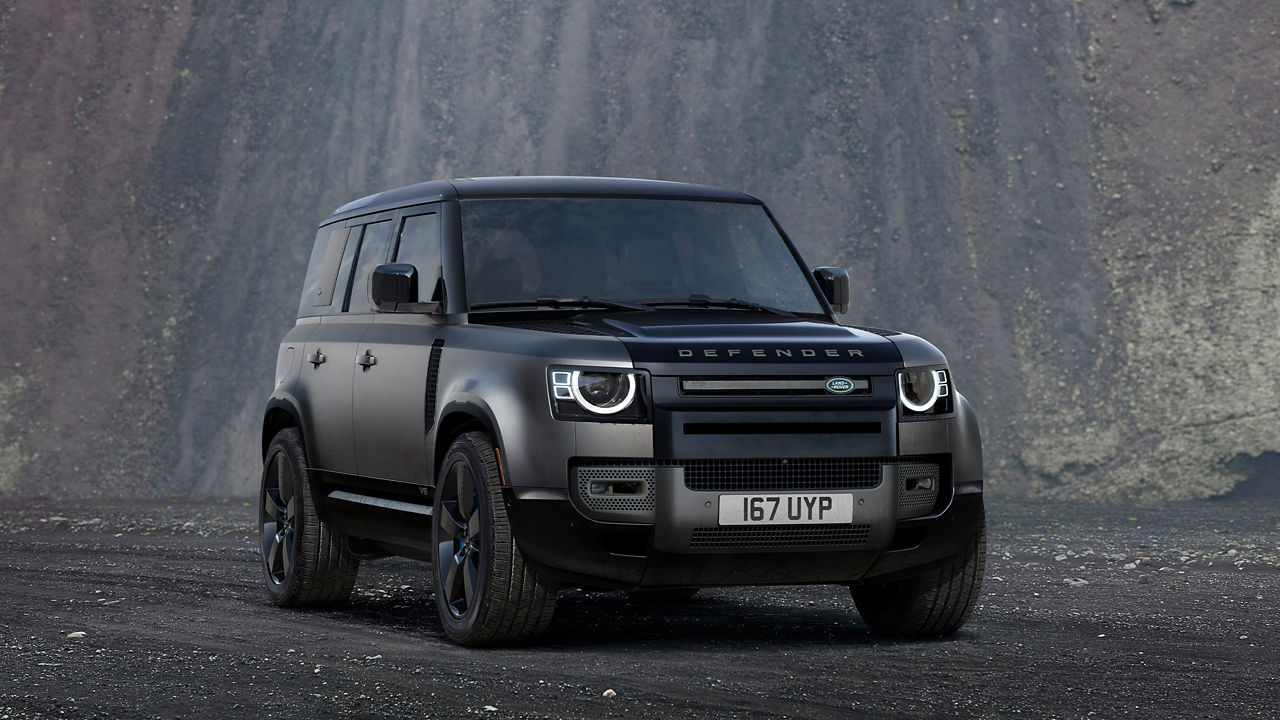 Defender 110 in Santorini Black parked outside.