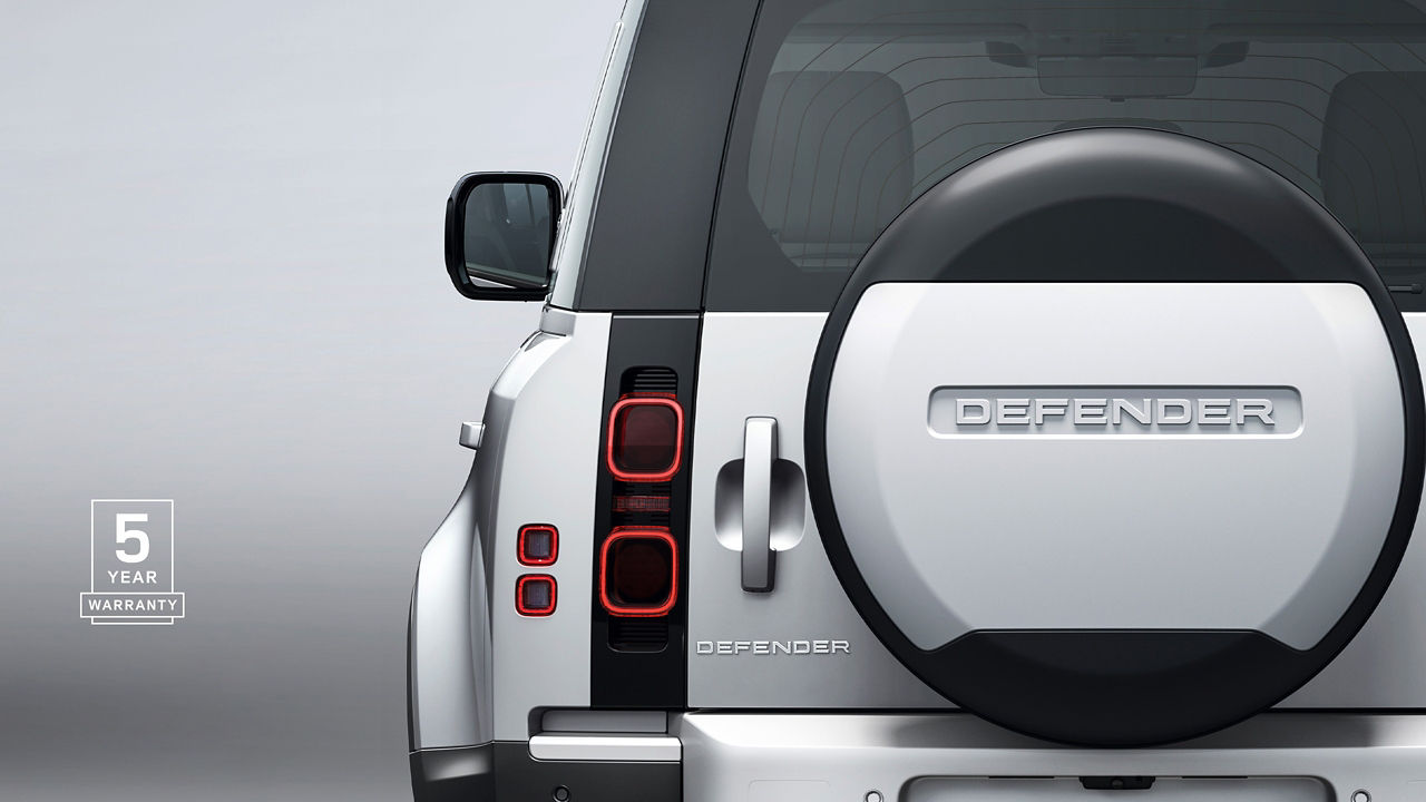 Land Rover Defender back side profile with 5 years warranty logo 