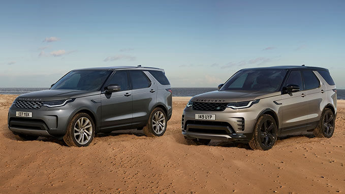 The Discovery and Discovery Sport parked on a sandy beach