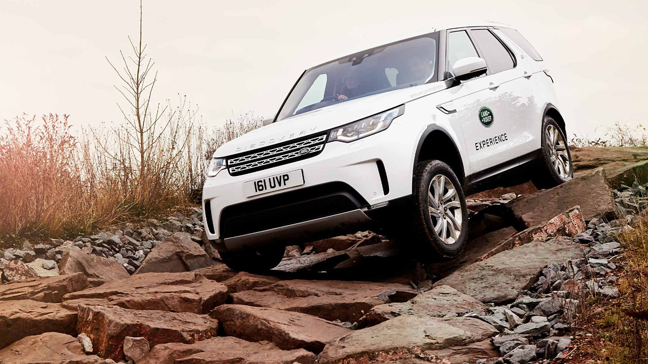 Range Rover on an off-road journey through the rock