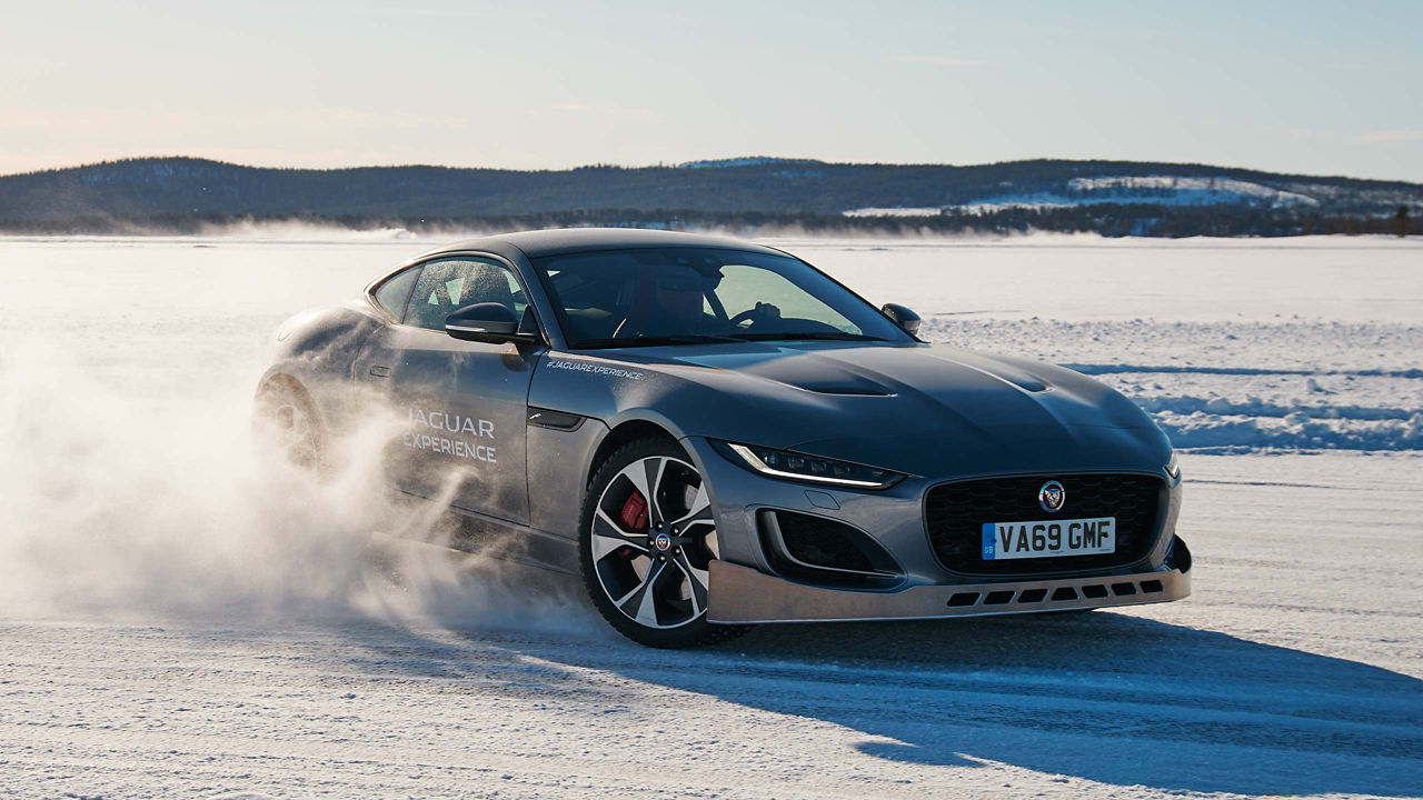 Jaguar F-Type driving around a snowy track