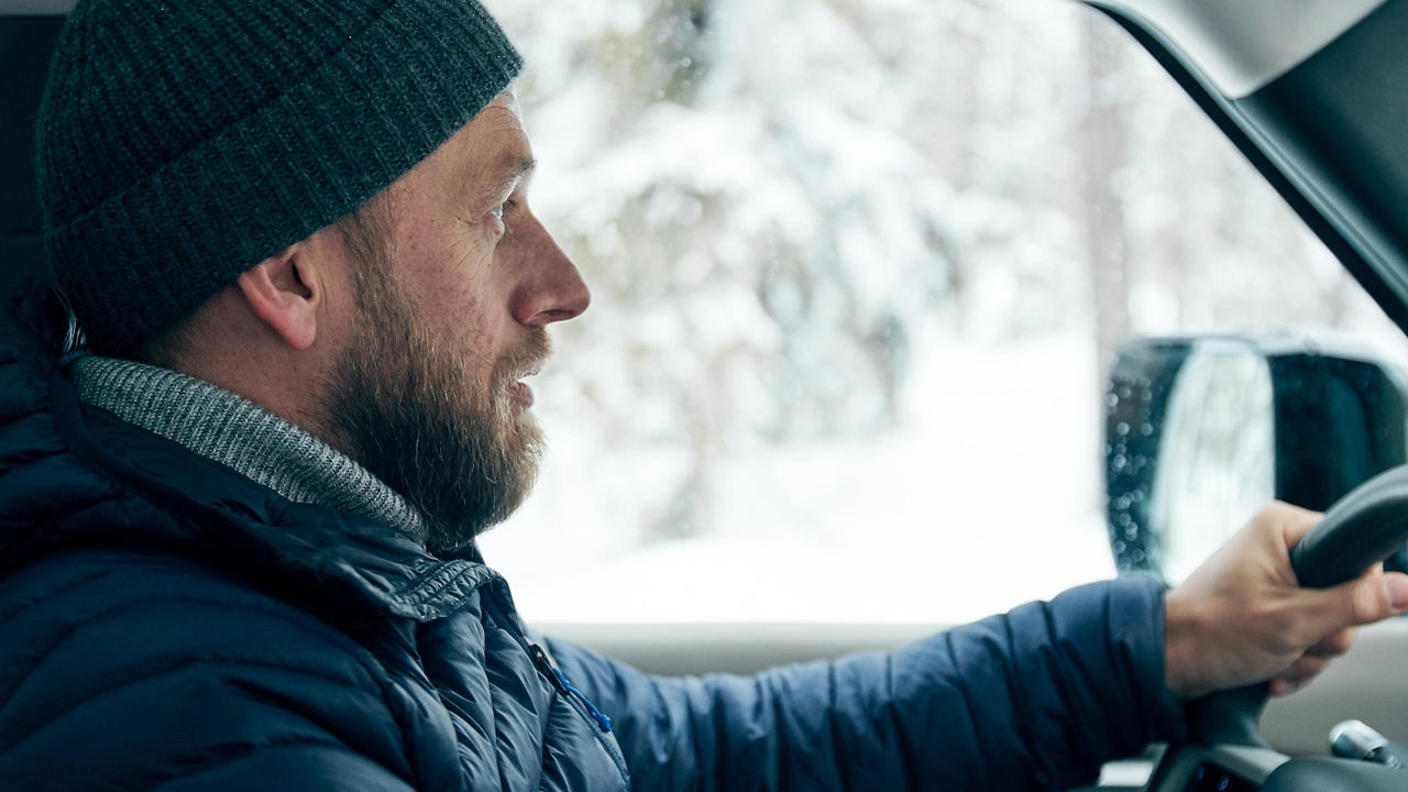 Male driving in icy road