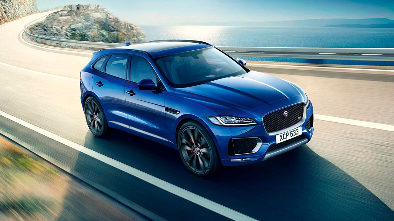 Jaguar F-Pace mountain road surrounded by sea