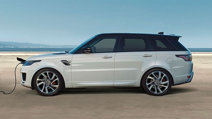 Land Rover vehicle in white is being charged