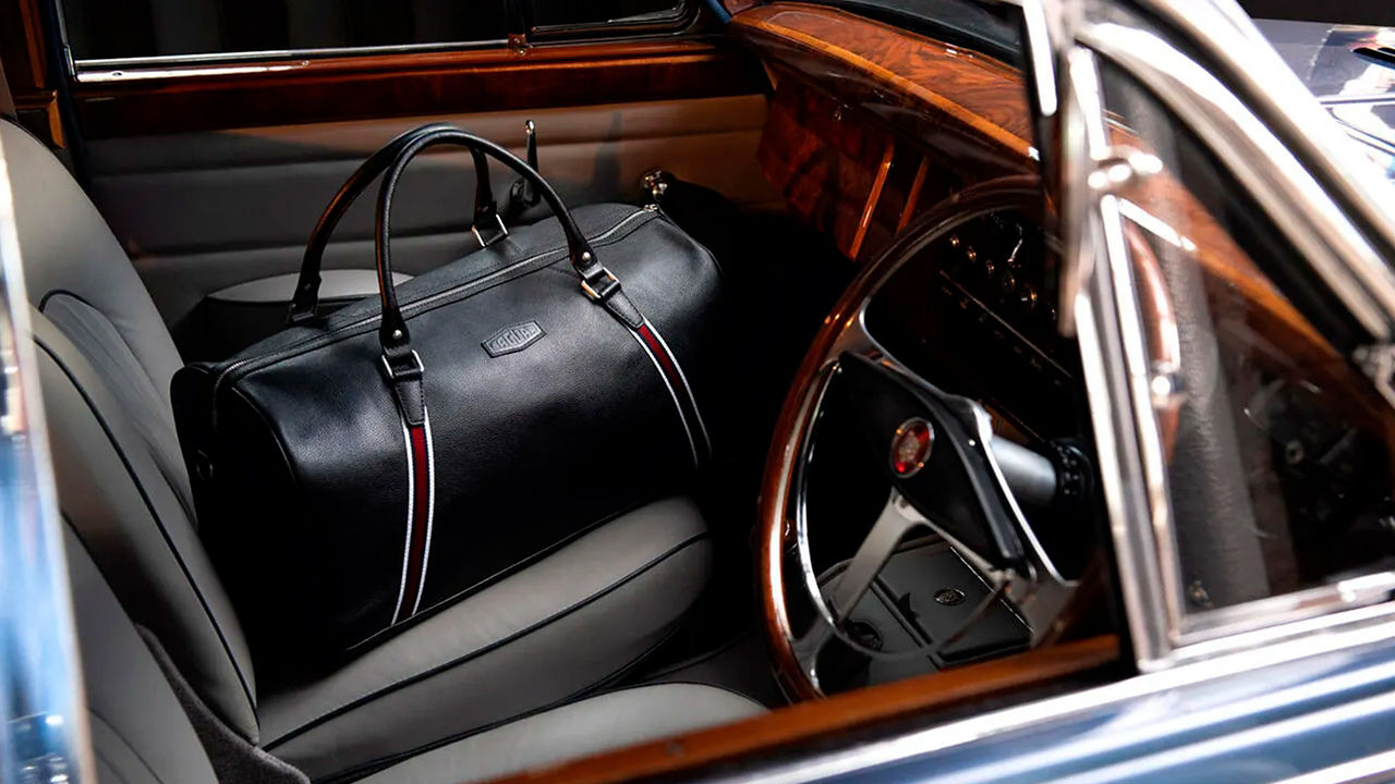 Jaguar E-Type bag placed in car