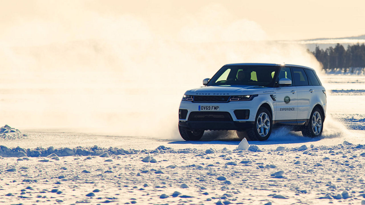 Range Rover driving on ice in a sunny scenery