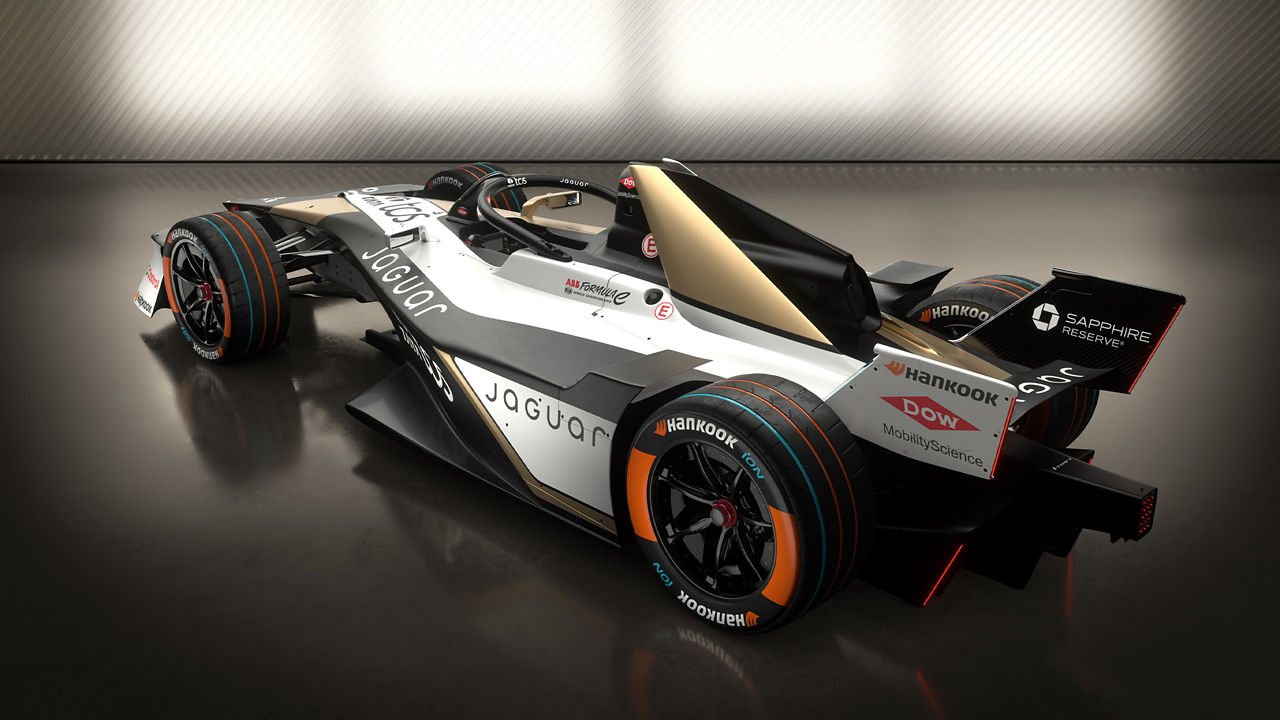 Rear three-quarter view of a Jaguar race Car highlighting its sponsor logos.