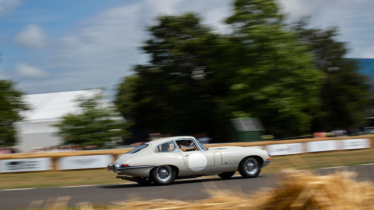 Jaguar Vintage Car in speed on the racetrack
