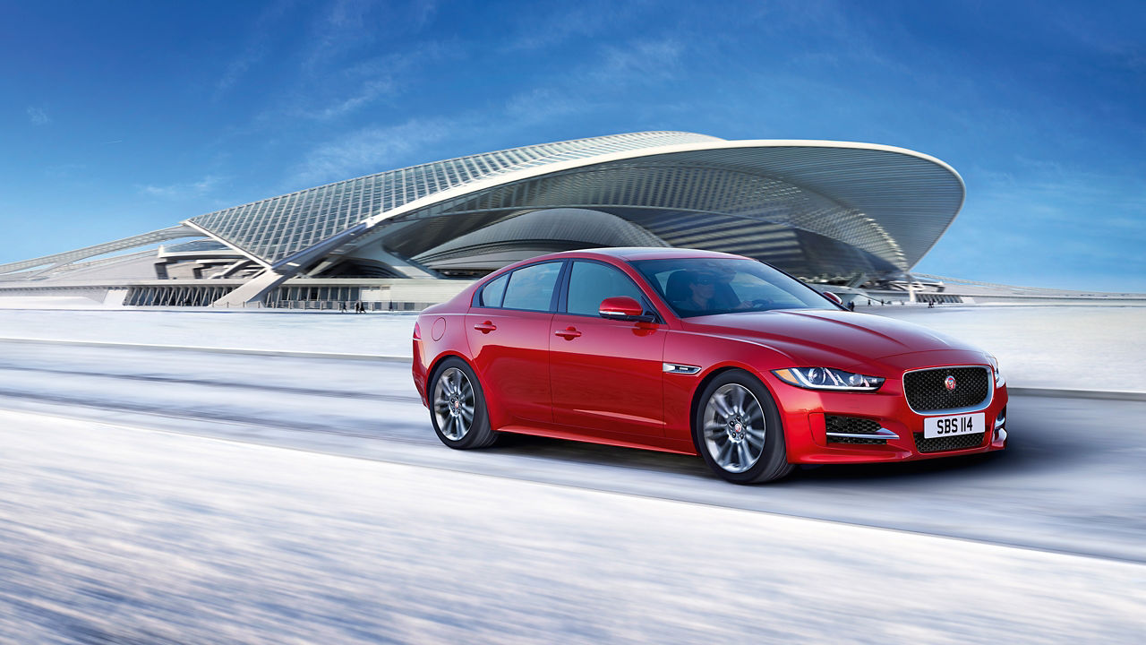 Jaguar XE running on runway road filled with snow