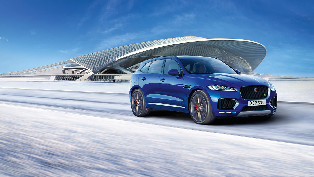 Jaguar F-PACE  running on runway road filled with snow