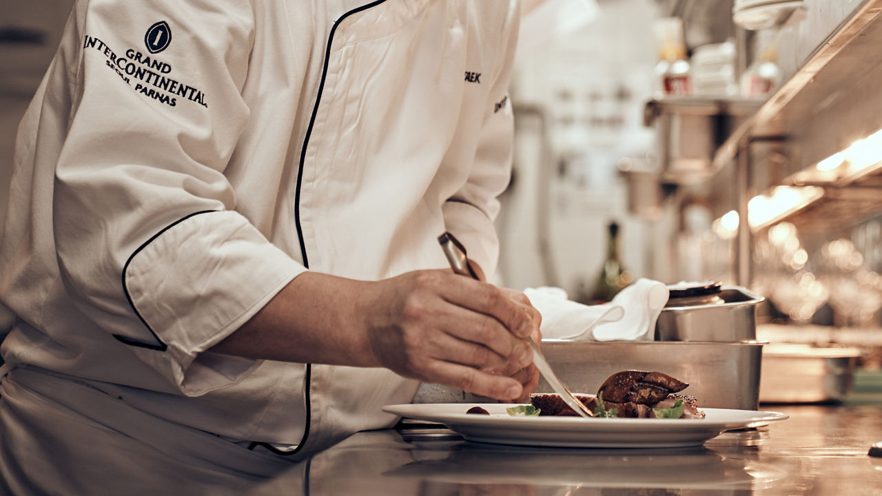 Restaurant Chef doing dressing on Plate